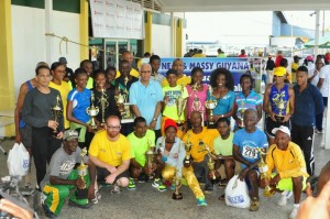 The winners of the 2013 edition of the AINLIM 10k pose after receiving their prizes on Sunday