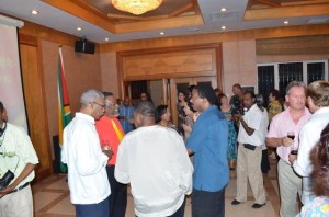 Acting President Samuel Hinds interacting with Opposition Leader David Granger and other guests at the 64th anniversary observance of the founding of the People’s Republic of China