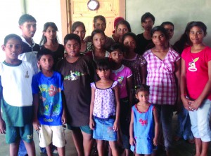 Alex Kahdhai (at left, first in second row) along with the other children of the Prabhu Sharan Orphanage