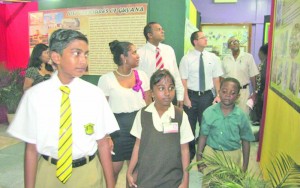 Wide-eyed with wonder, these students, along with Culture, Youth and Sport Minister Dr Frank Anthony and Guyana National Trust Chief Executive Officer Nirvana Persaud, were among persons viewing the annual Heritage Exhibition at the National Library (GINA photo)