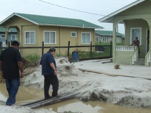 Housing Minister Irfaan Ali accompanies St Vincent and the Grenadines Prime Minister Dr Ralph Gonsalves on a tour of one of the homes in Eccles