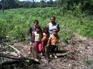 Daniels, who cultivates two acres, with her children who help on weekends