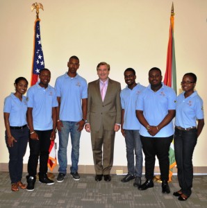 U.S. Ambassador D Brent Hardt poses with the youth ambassadors before their departure