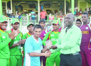 Jashim Uddin collects the Man-of-the-Match award from Colin Stuart (Rajiv Bisnauth photos) 