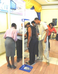 'Fit It Guyana' team screens registrants before they embark on their journey