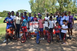 Race officials and representatives of Hand-in-Hand Insurance Limited pose with the outstanding riders at the conclusion of Saturday’s programme