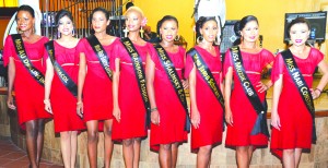 The eight delegates of the Miss Guyana Universe 2013 pageant with their sponsorship sashes 