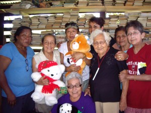 The Moruca ladies who help in distributing the toys. Regina is far right (in red shirt)