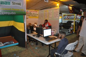 Youths learning about computers  at Region Two Ministry of Education's exhibit