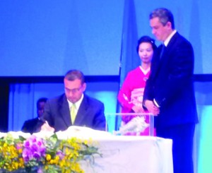 Natural Resources and Environment Minister Robert Persaud signing the Minamata Convention on Mercury