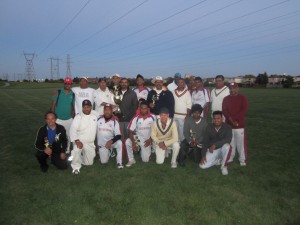 Members of the Toronto Police cricket team strike a pose just after their match against Sugarcane Thunderbolts Cricket Club recently (Ravendra Madholall photo)