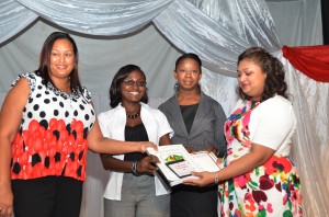 Education Minister Priya Manickchand (right) with developers of the Portuguese curriculum