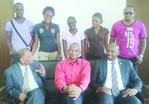 Agriculture Minister Dr Leslie Ramsammy and his St Vincent and the Grenadines counterpart, Sabato Caesar pose with the students  