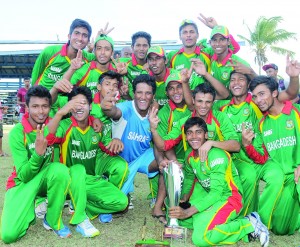  Members of the victorious Bangladesh under-19 team posing with the winner's trophy after defeating the West Indies under-19 Monday at the Everest Cricket Club ground