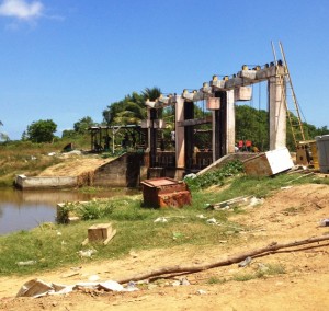 Modern koker along the Berbice River to control drainage and irrigation in the area