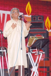 The late Pandit Reepu Daman Persaud, creator of the annual Diwali Motorcade, speaks at a 2005 Diwali cultural presentation