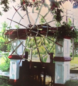 From a Dutch Heritage. The Camp Street, Georgetown koker that once formed part of an irrigation system for Plantation Thomas. It was reconstructed in 1938 of reinforced concrete, traditional roof and wheel, and worm door lifting gear (Heritage Guyana, Oct 2011)