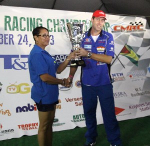 GMR&SC Supervisor Desiree Lee presents the 2013 Seaboard Marine CMRC Champion Driver trophy to Doug Gore