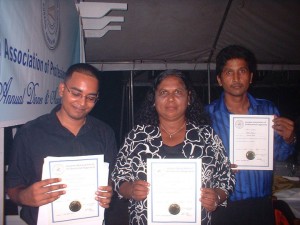 Jean and colleagues showcase their certificates of recognition from the Guyana Association of Professional Engineers