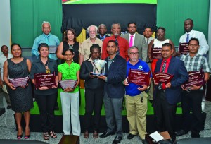 Prime Minister Samuel Hinds, acting Tourism Minister Irfaan Ali, and Tourism and Hospitality Association of Guyana (THAG) President Christopher Nascimento pose with the Guyana Tourism Awardees 2013 on Wednesday evening at the Guyana International Conference Centre, Liliendaal, Greater Georgetown