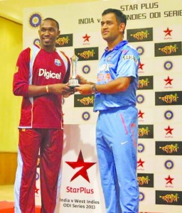 Captains Dwayne Bravo and Mahendra Singh Dhoni with the series trophy