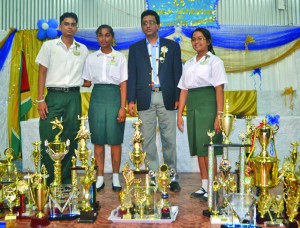 Attorney General Anil Nandlall with top students, including Yogeeta Persaud (right) and Zimeena Rasheed (second left)  