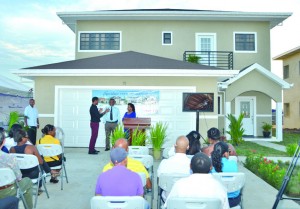 Navigant Builders Inc Chief Executive Officer Danny Sawh explains the details of the house to Prime Minister Samuel Hinds and Mrs Hinds at the offical launch on Saturday 