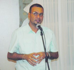 Natural Resources and Environment Minister Robert Persaud  speaking prior to the screening of “Amazon Gold”