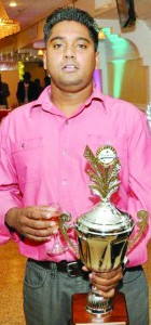 Ejaz Mohamed poses with his trophy