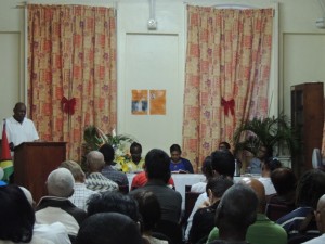 Caribbean arts critic and former deputy vice-chancellor of UG, Al Creighton (L) speaks at the launch of the new book documenting Guyanese literature