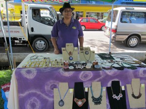 Artist Deborah Matthias showcasing her collection of handmade jewellery