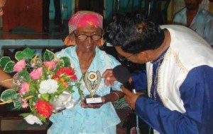 Bhuali being awarded for her devotion