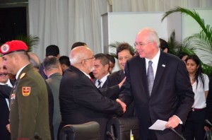 President Donald Ramotar greets Minister of Energy and Petroleum and President of PDVSA Rafael Ramírez at the ALBA-PETROCARIBE Summit in Caracas, Venezuela. 