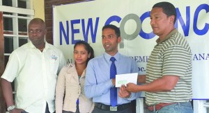 Manager of NEW GPC INC., Trevor Bassoo (second right), presents his company’s sponsorship to Kashif Muhammad in the presence of Aubrey “Shanghai” Major (left) of the K&S Organisation and Marketing Associate of NEW GPC INC Livasti Bhooplall