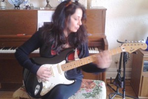 Radha on her guitar