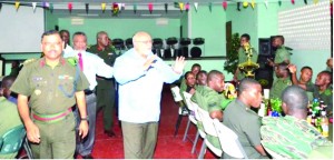 President Donald Ramotar and Prime Minister Samuel Hinds greet soldiers at the GDF Christmas luncheon