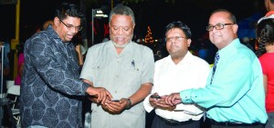 Acting Tourism Minister Irfaan Ali, Prime Minister Samuel Hinds Finance Minister, Dr Ashni Singh, along with former Tourism Minister Maniram Prashad, preparing to light up the Main Street Christmas Village