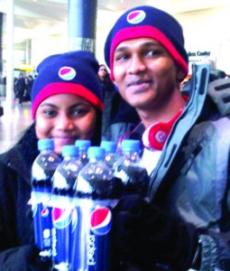 Brian Persaud and a guest at the John F Kennedy Airport upon arrival in the U.S.