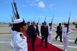 President Donald Ramotar being escorted to the venue in Caracas, Venezuela for the ALBA-PETROCARIBE Summit.