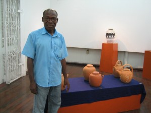 Austin with a few of his pieces at a past exhibition at Castellani House