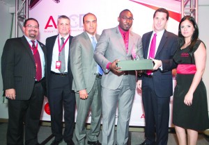 Digicel Business Enterprise Account Manager Duwayne Watson (third right), collects the Avaya artner of the Year award from Avaya’s Systems Sales Engineer, Nikolas Schnoor (right) at the Avaya Partner Connection Day Awards held in Puerto Rico on January 16. Looking on are (from left to right), Marketing Manager for the Caribbean and Central America, Ramon Lopez; Managing Director Jose Fernandez; Channel Sales Leader Santiago Aguirre and another official