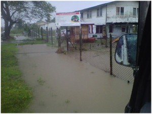 Floodwaters surround a house