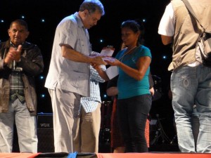 Goretti Luiz (right) collecting a plaque of participation on behalf of the Guyana team from the president of SESC