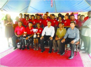 Minister of Culture, Youth and Sport Dr Frank Anthony (front row in white shirt) and other officials with graduates  at Smythfiled Drop-In Centre last year