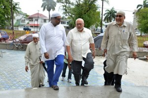 President Donald Ramotar is flanked by Minister Ali and Central Islamic Organisation of Guyana (CIOG) President Fazil Feroze as he enters the Queenstown Masjid