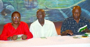 Acting Vice-Chancellor Phillip Da Silva (centre), Guyana Prize for Literature Management Committee General Secretary Al Creighton, another staff and member of the university at the launch at the Umana Yana