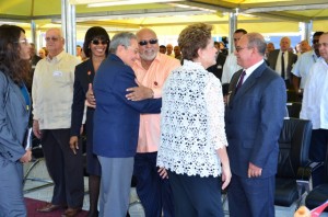 President Donald Ramotar (centre) greeting Cuban President Raul Castro at the opening of the Mariel Container terminal in Cuba earlier  this week. The event coincided with the opening of the CELAC Summit in Havana, Cuba. (GINA photo)