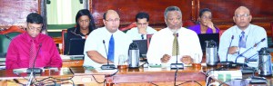 Prime Minister Samuel Hinds sitting beside GPL Chairman Winston Brassington (second left) and GPL Chief Executive Officer Bharat Dindyal at the parliamentary sectoral meeting