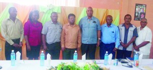 Finance Minister, Dr Ashni Singh and his junior counterpart, Juan Edghill pose with members of the LEN Board