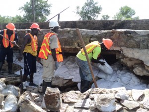 Sand bags being placed into the cavity by the Force Account Unit team